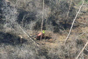 shot taken from bucket truck of worker cleaning the lot